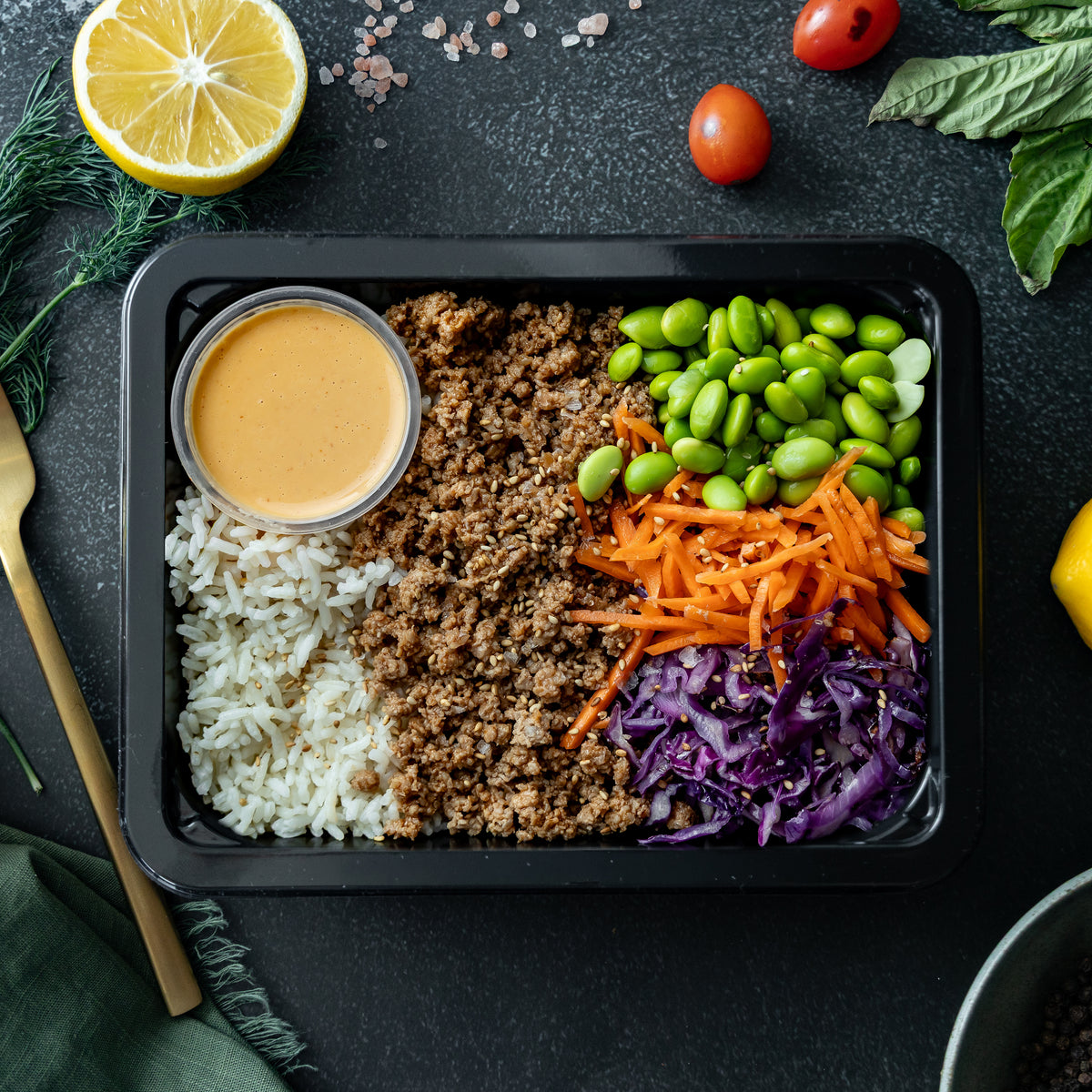 Turkey Bulgogi Bowl - Bulgogi-marinated ground turkey over basmati rice with edamame, shredded red cabbage, and pickled carrots – finished with a drizzle of…