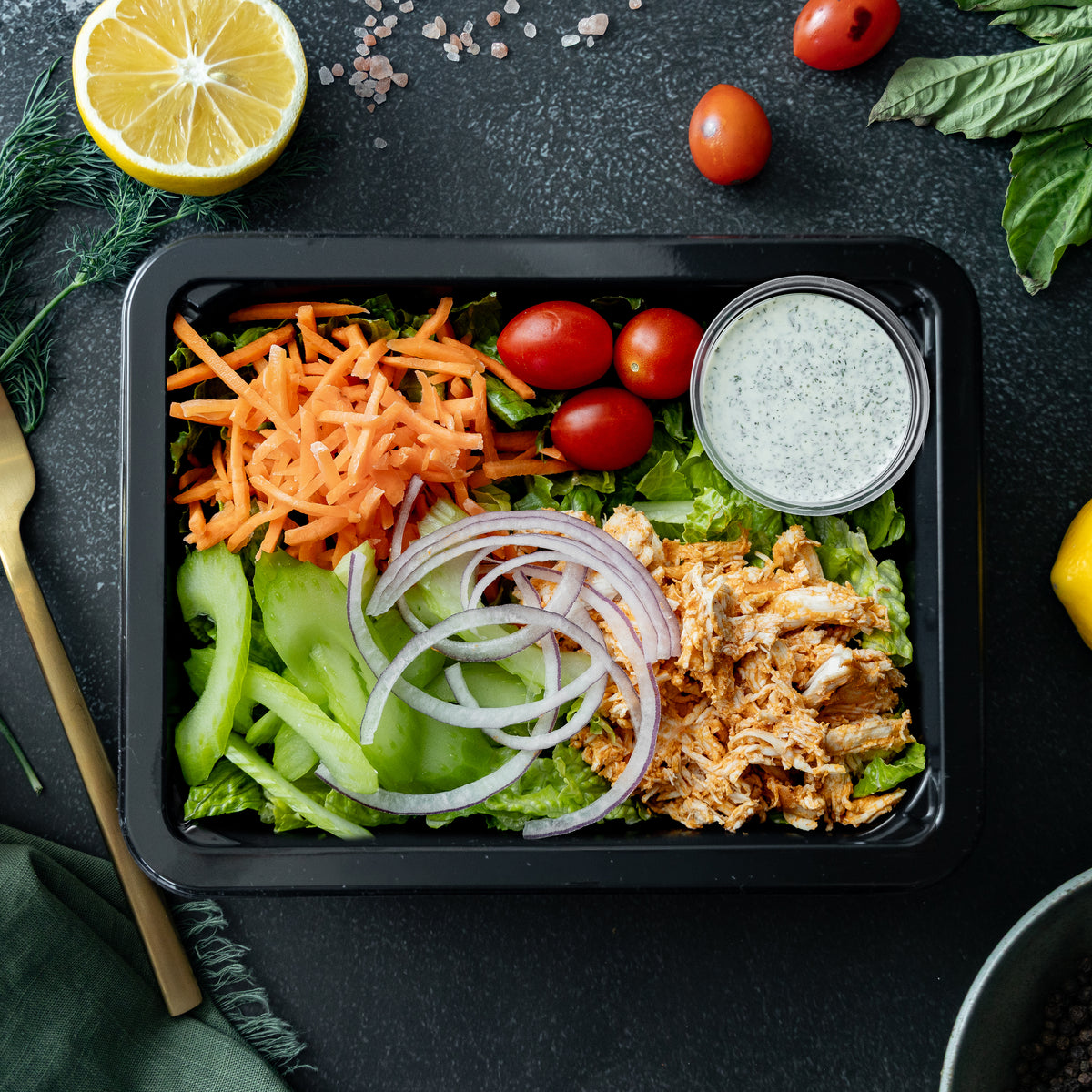 Buffalo Chicken Salad - Crisp romaine topped with spicy buffalo-glazed chicken breast, crunchy celery and carrots, and served with a house-made ranch dressing