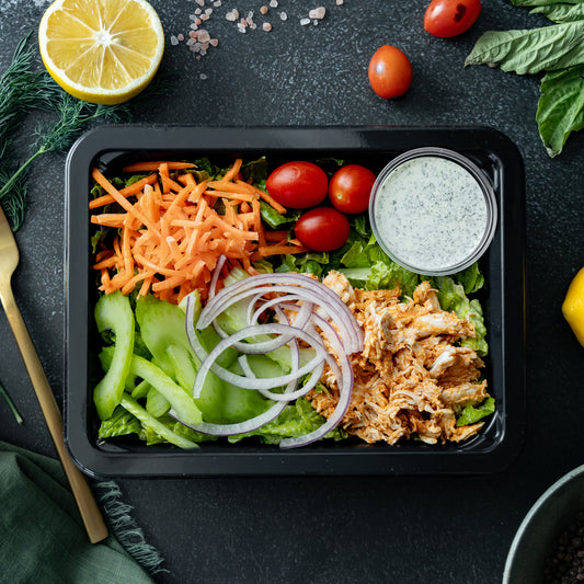 Buffalo Chicken Salad - Crisp romaine topped with spicy buffalo-glazed chicken breast, crunchy celery and carrots, and served with a house-made ranch dressing