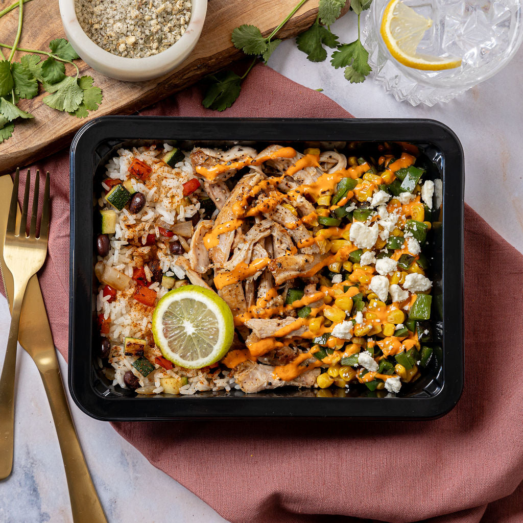 Blackened Chicken & Mexican Street Corn - Shredded blackened chicken thigh with a colorful rice pilaf, black beans, and Mexican street corn topped with Cotija cheese