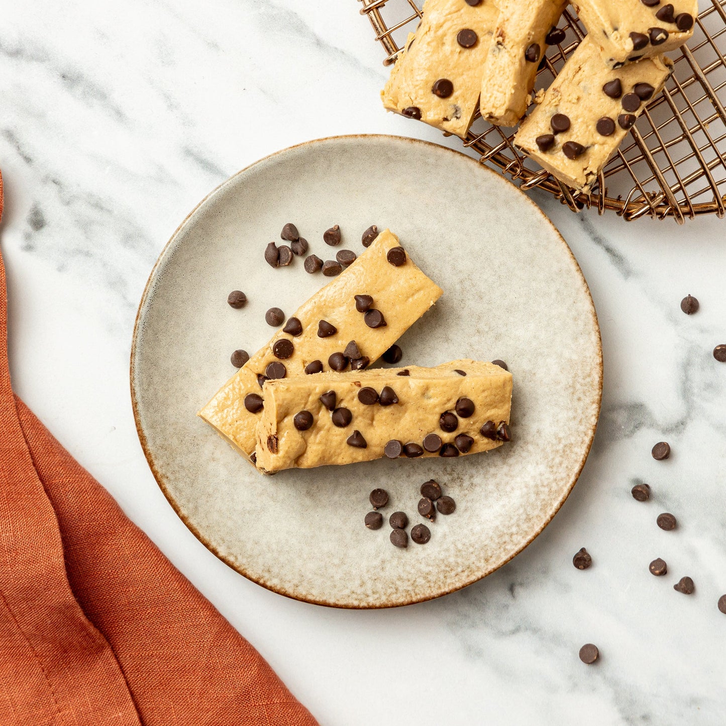 PB Cookie Dough Protein Bars - Soft, chewy peanut butter bars with vanilla protein, dark chocolate chips, and a touch of maple