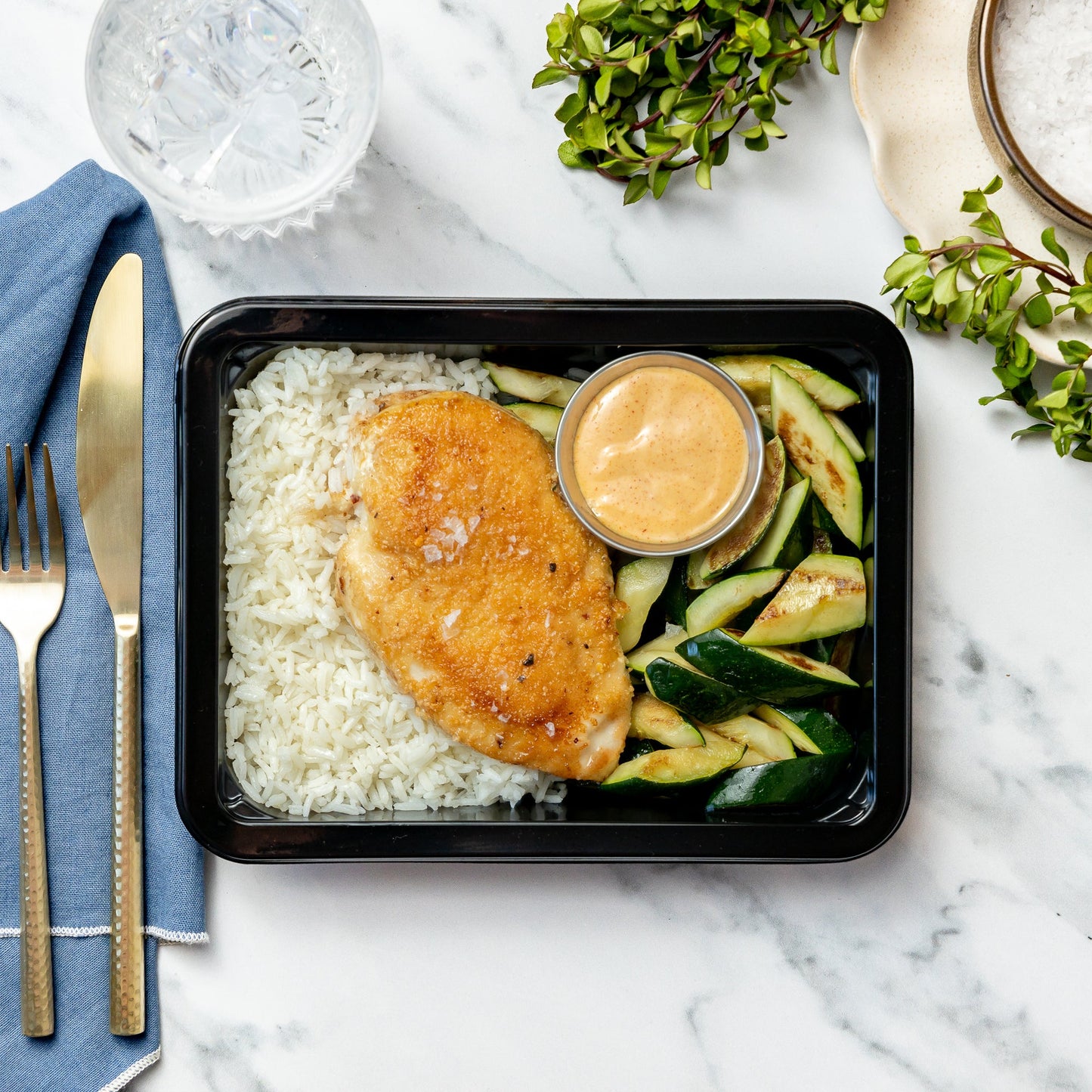Firecracker Chicken - Crispy gluten-free breaded chicken breast served with a sweet and spicy firecracker sauce, served over basmati rice and zucchini