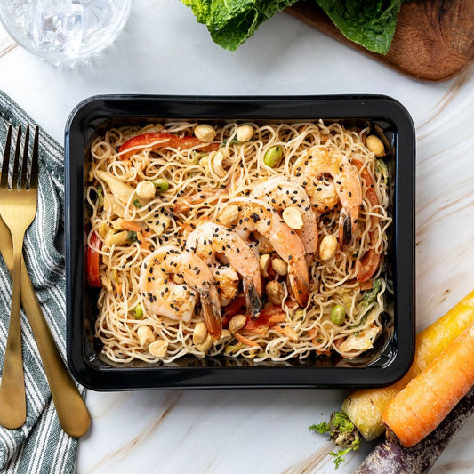 Thai Peanut Shrimp - Garlic ginger shrimp, rice noodles, veggies, garlic, ginger, edamame, fit-flavors peanut sauce, and peanuts