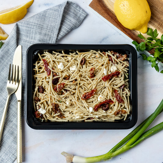 Bulk Mediterranean Pasta - Whole grain pasta mixed with goat cheese, sun dried tomato, and pine nut pesto