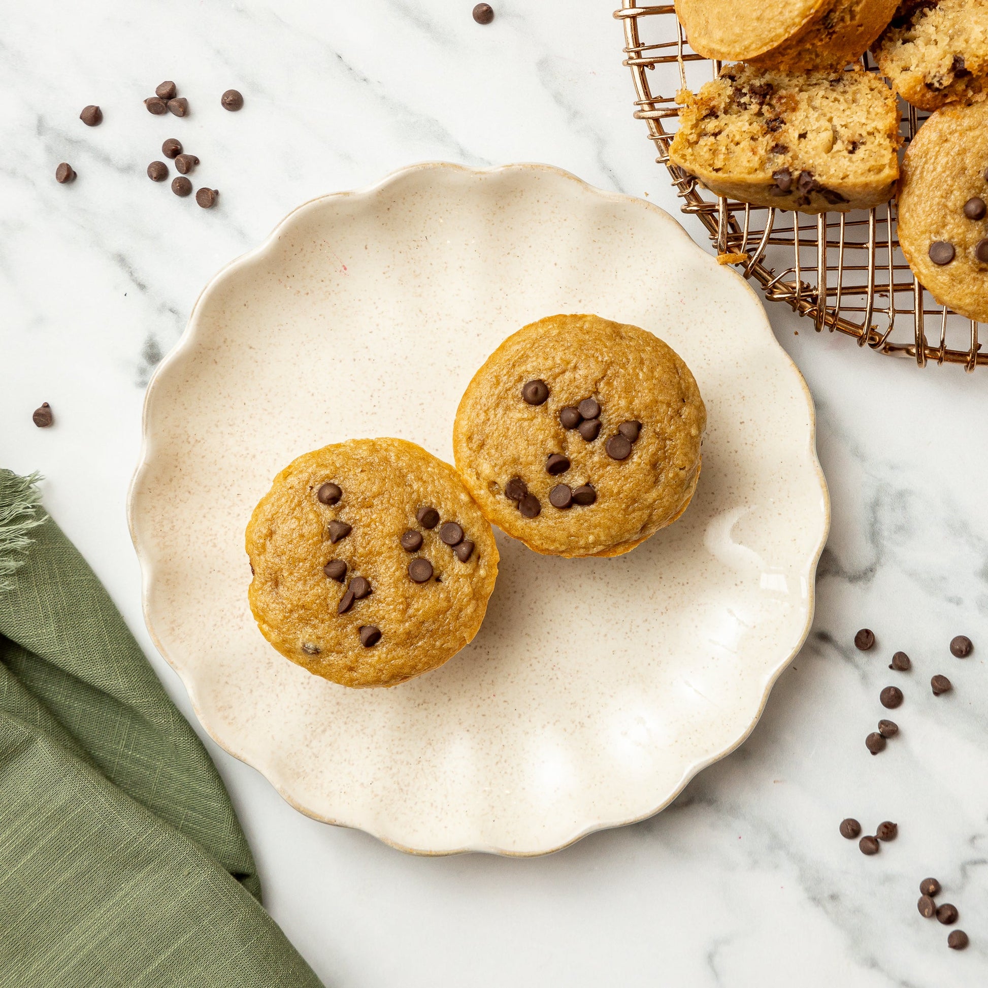 Chocolate Chip Muffins - Tender oat flour muffins baked with rich Greek yogurt and pure maple syrup, then folded with dark chocolate chips for a subtly sweet,…