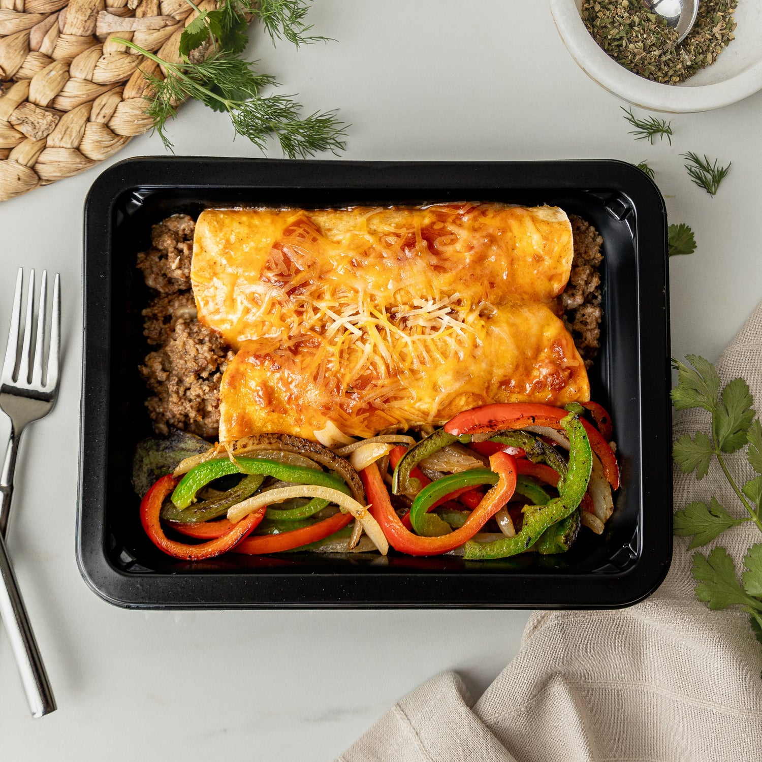 Lean Beef Enchiladas Rojas - Savory ground beef rolled into enchiladas and finished with a rich red sauce and fajita vegetables