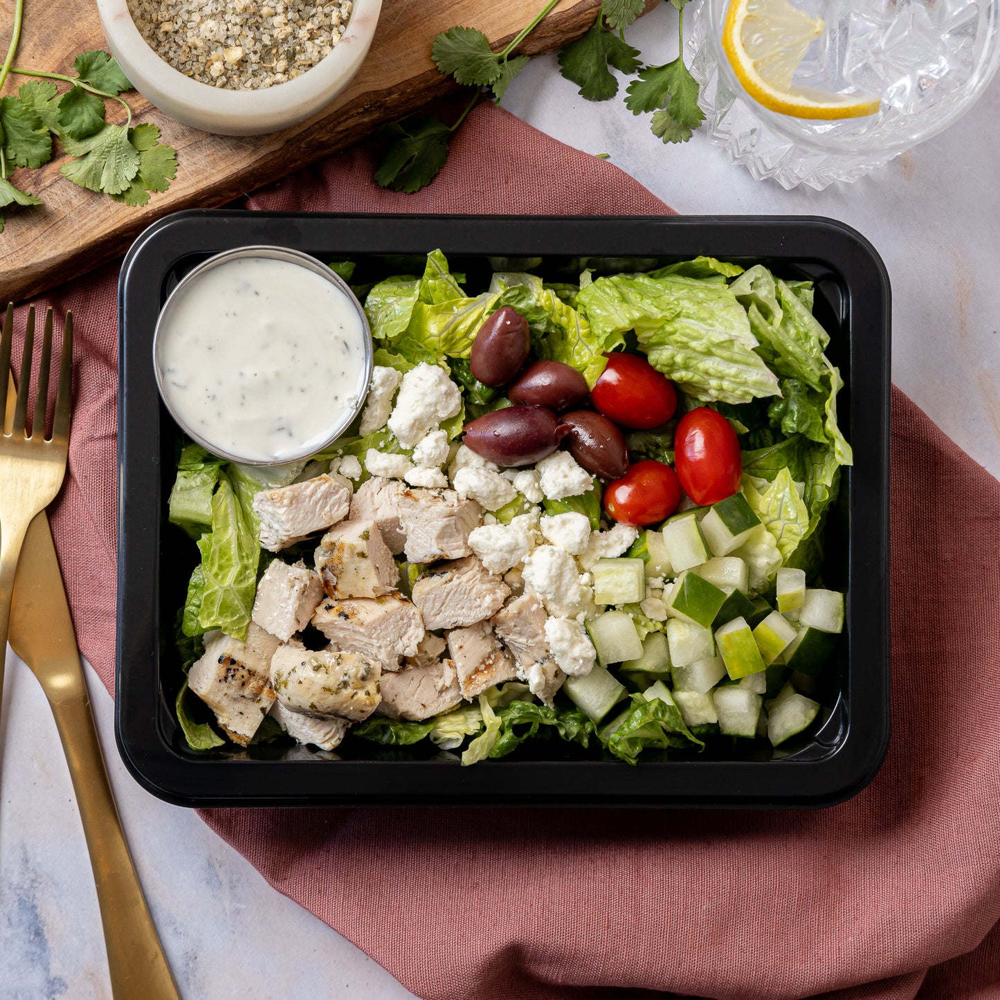 Greek Salad - Romaine lettuce, herb grilled chicken, grape tomatoes, cucumbers, Kalamata olives, feta cheese, with creamy Italian dressing