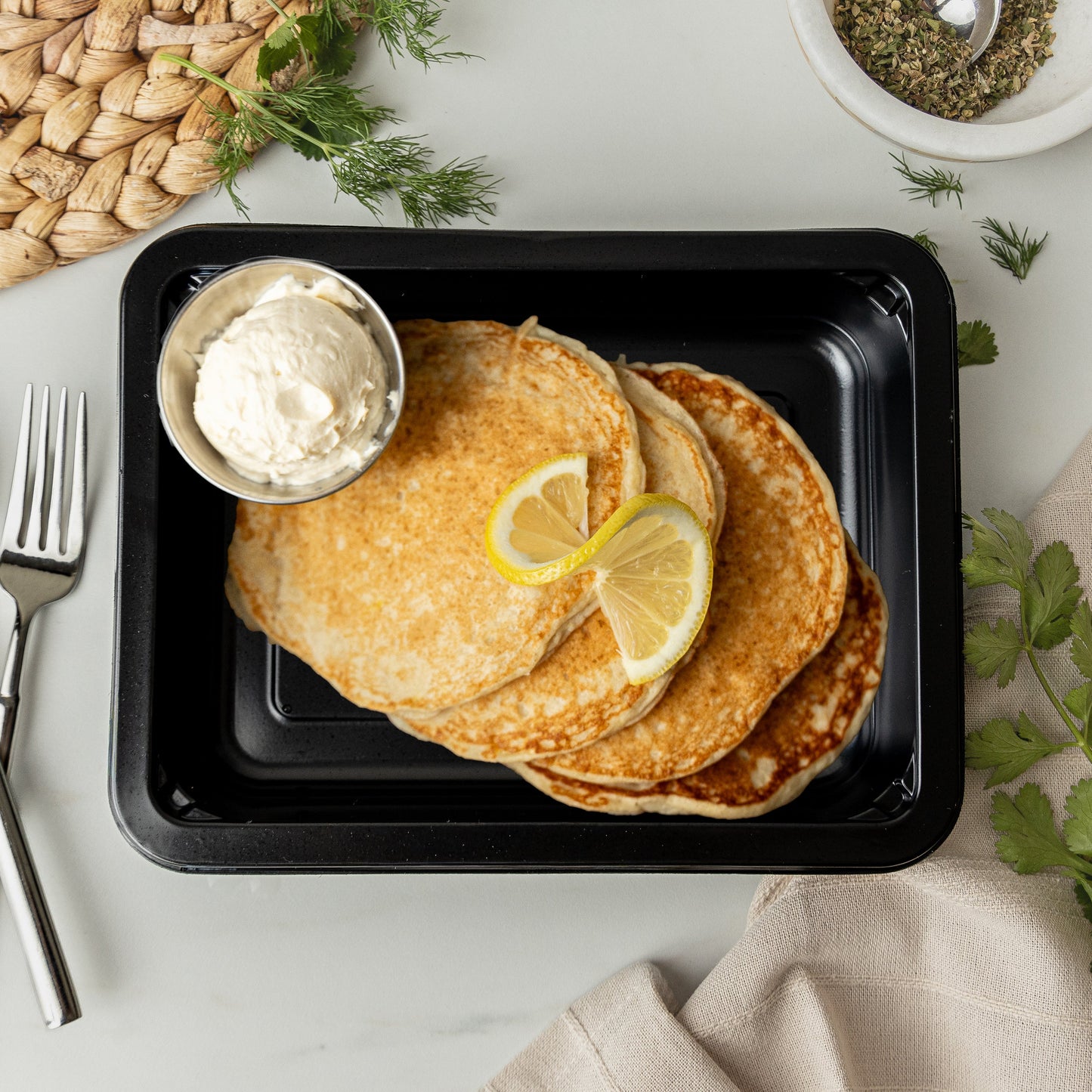 Lemon Ricotta Pancakes - Lemon ricotta pancakes topped with creamy yogurt cheesecake frosting