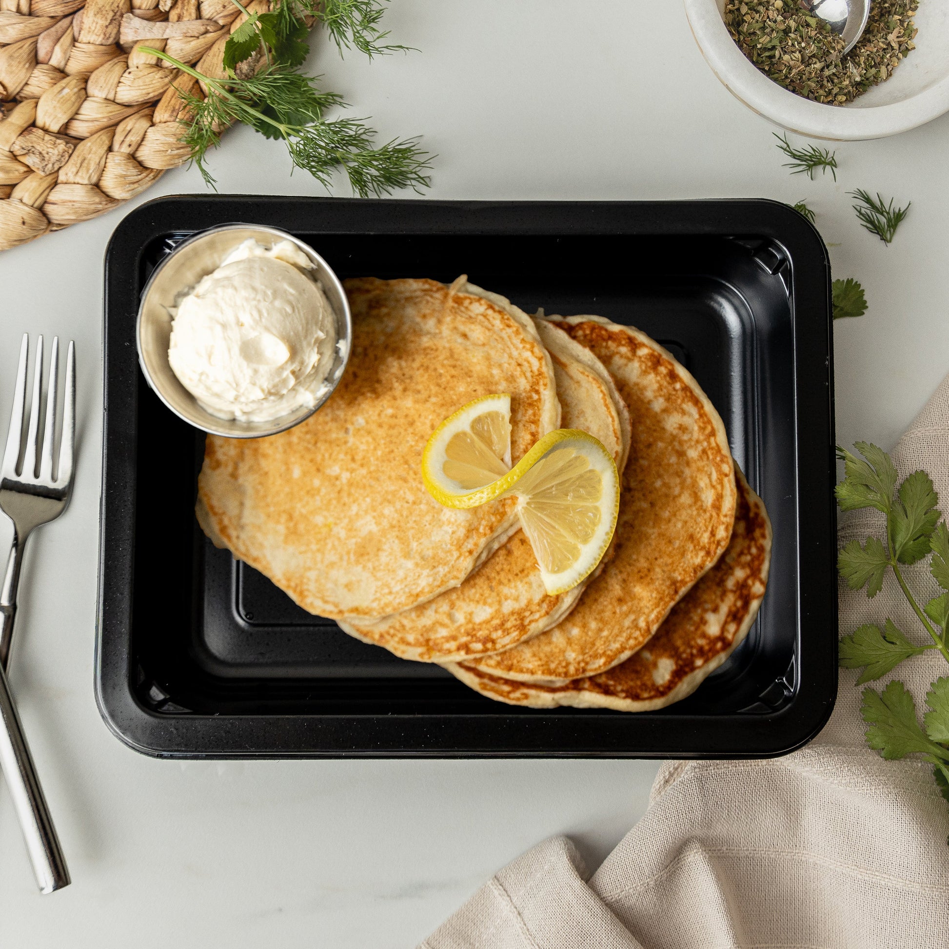 Lemon Ricotta Pancakes - Lemon ricotta pancakes topped with creamy yogurt cheesecake frosting