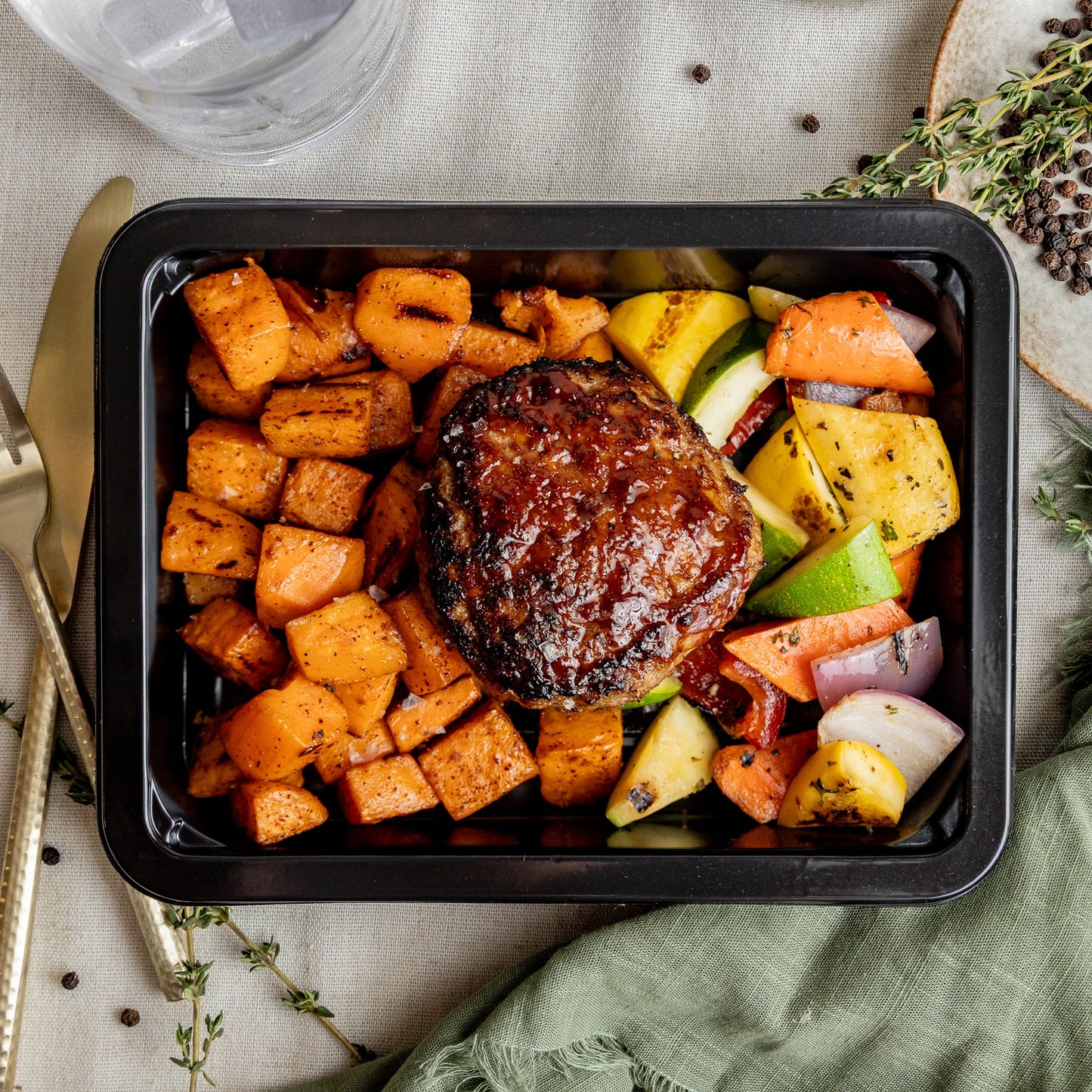BBQ Meatloaf Burger - Juicy turkey burger glazed in our house sweet honey BBQ, served with roasted sweet potatoes and a grilled veg blend