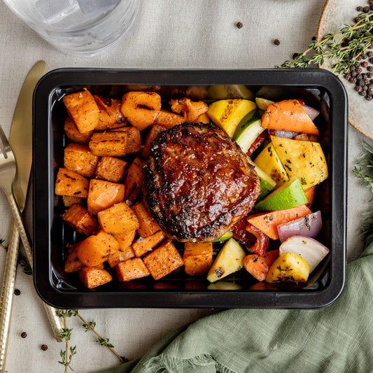 BBQ Meatloaf Burger - Juicy turkey burger glazed in our house sweet honey BBQ, served with roasted sweet potatoes and a grilled veg blend