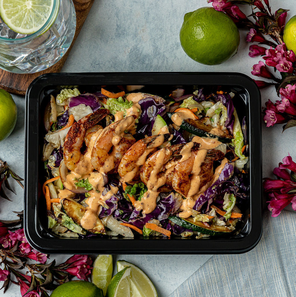 Firecracker Shrimp - Sautéed shrimp with our house Thai chili sauce over a colorful mix of cabbage, carrots, zucchini, and red onion and dressed in a spicy mayo