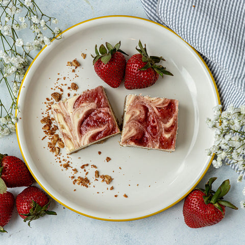 Strawberry Cheesecake - Low sugar Greek yogurt and cream cheese cheesecake filling swirled with strawberry compote with a protein oat crust